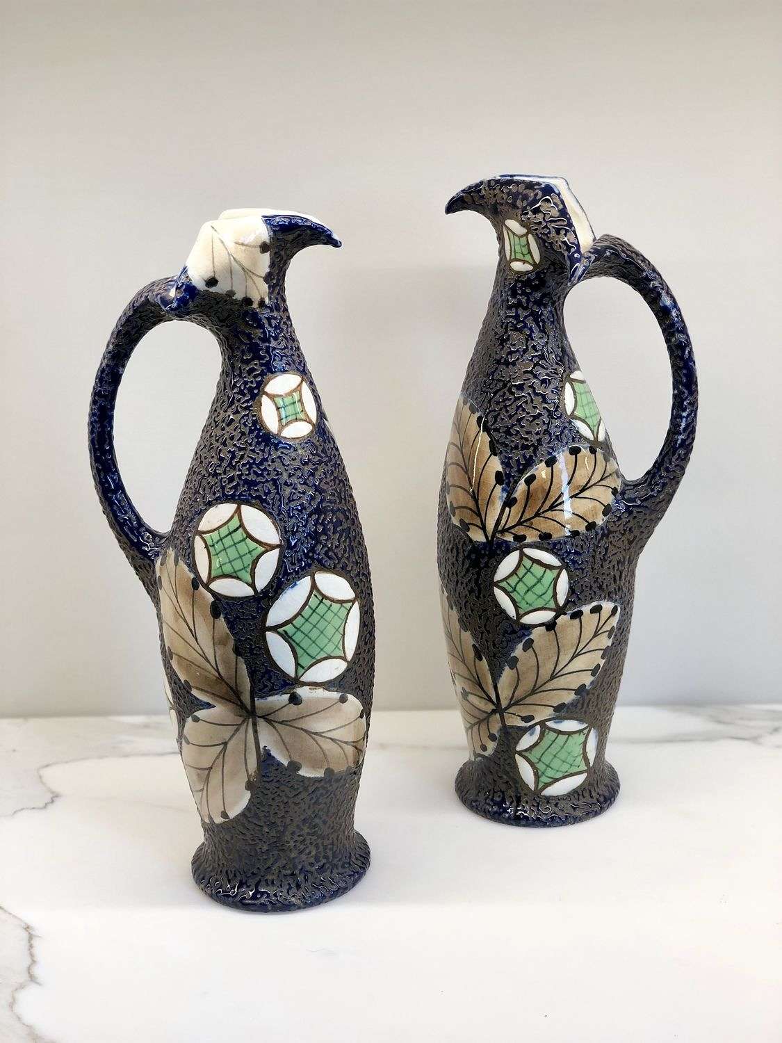 Exquisite pair of Art Nouveau Amphora enamelled jugs