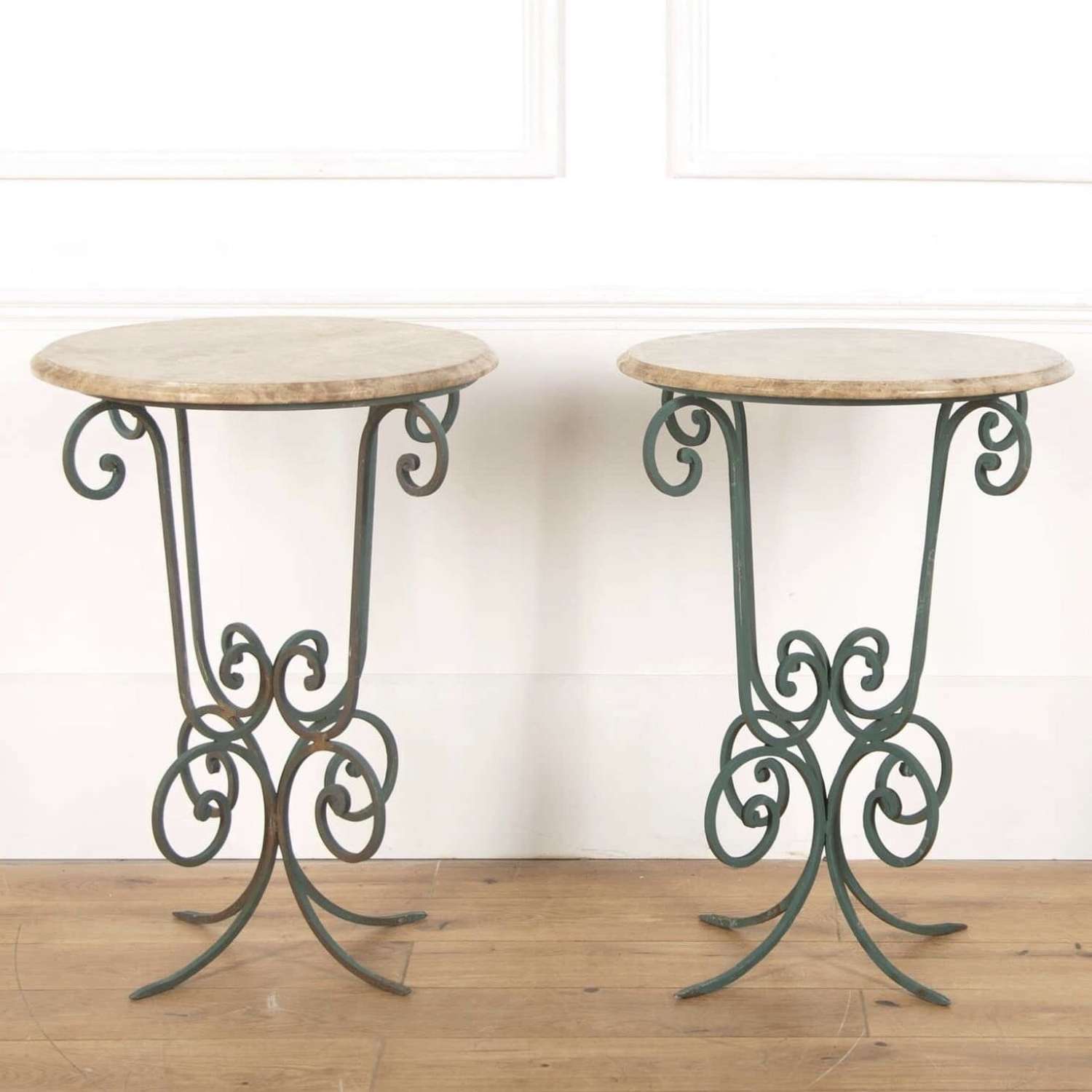 Decorative pair of stone and painted scroll iron tables