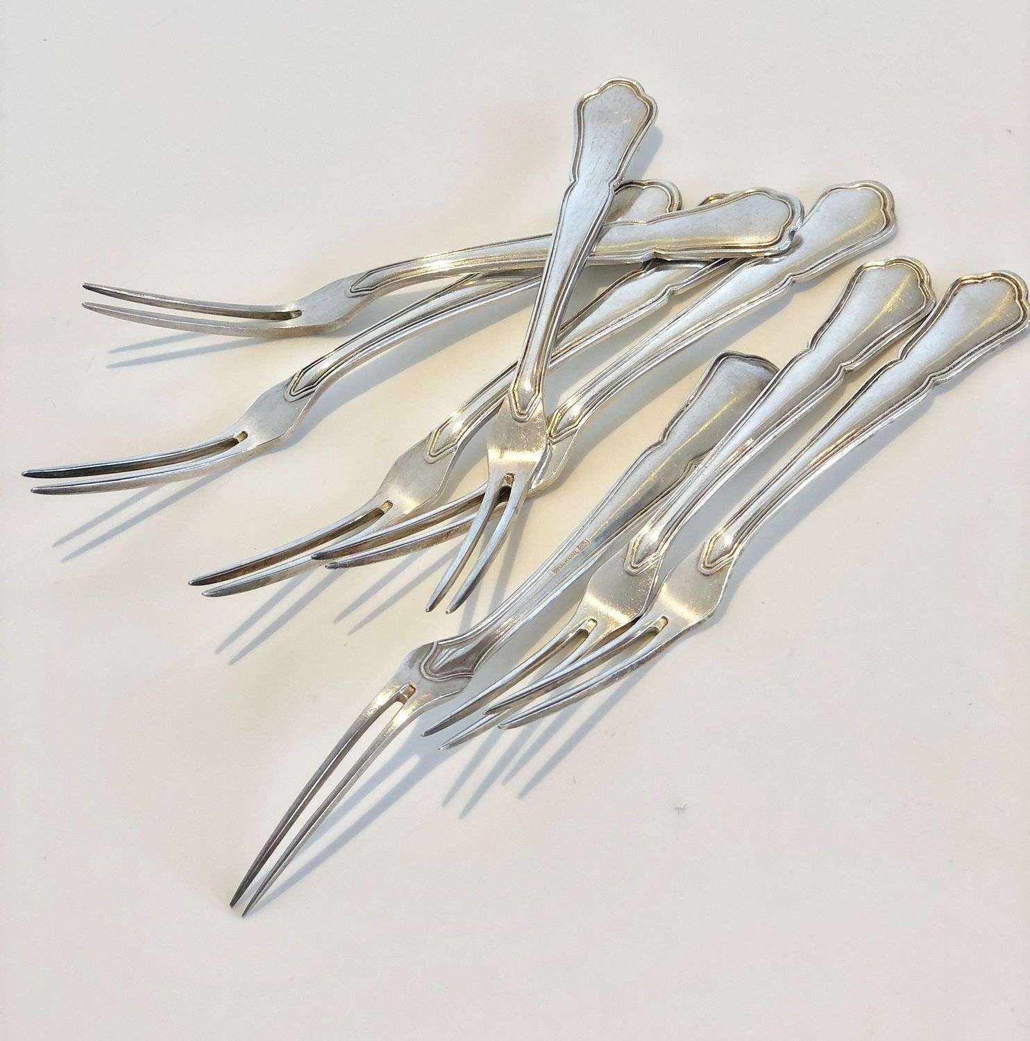 Smart set of eight French silver plated lobster forks