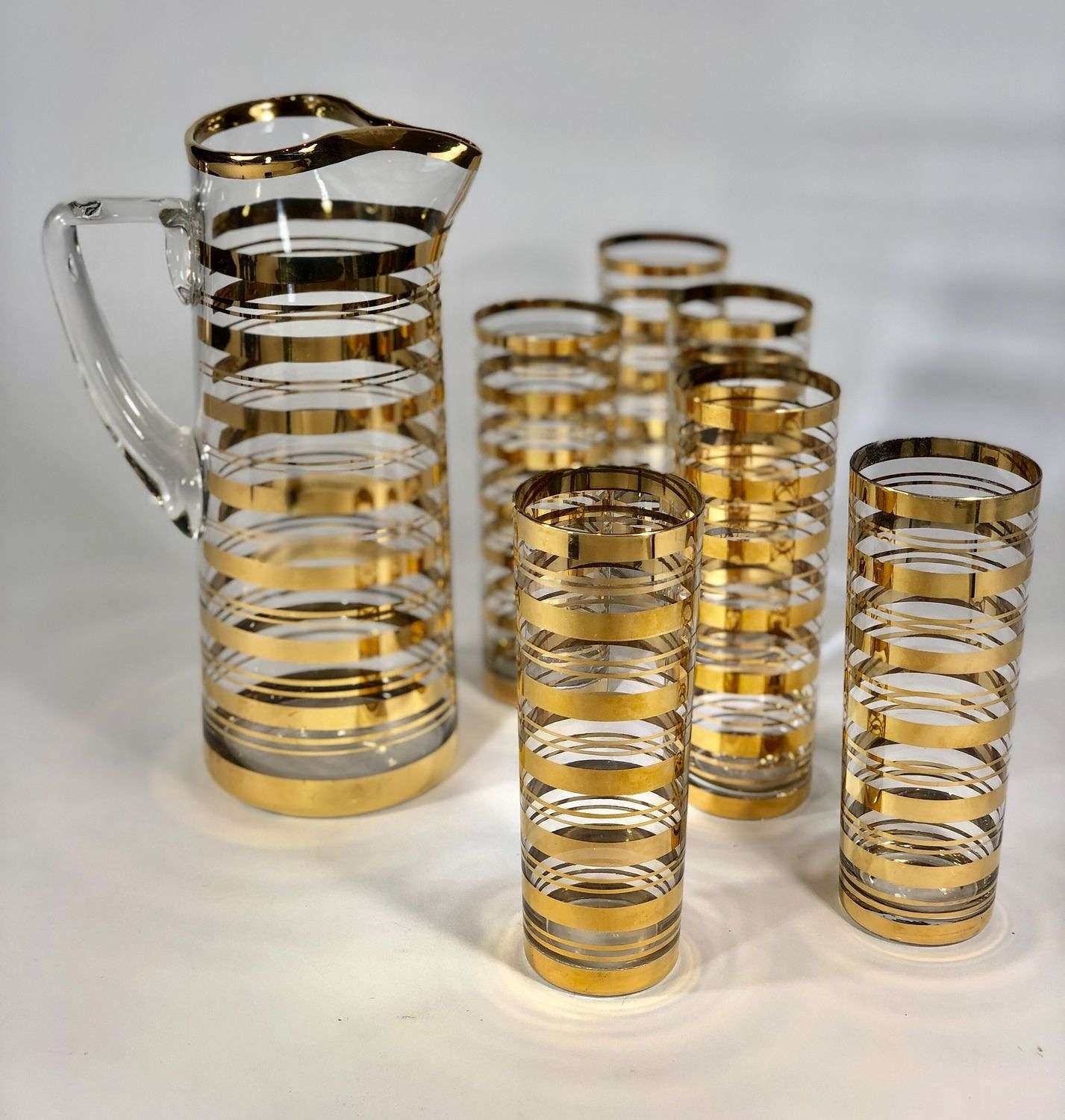 Mid 20th Century 22carat gold cocktail jug and tall tumblers