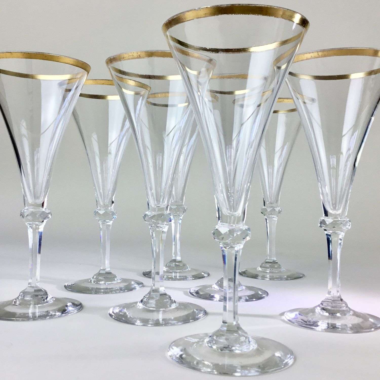 Eight 19th Century gold rimmed champagne flutes
