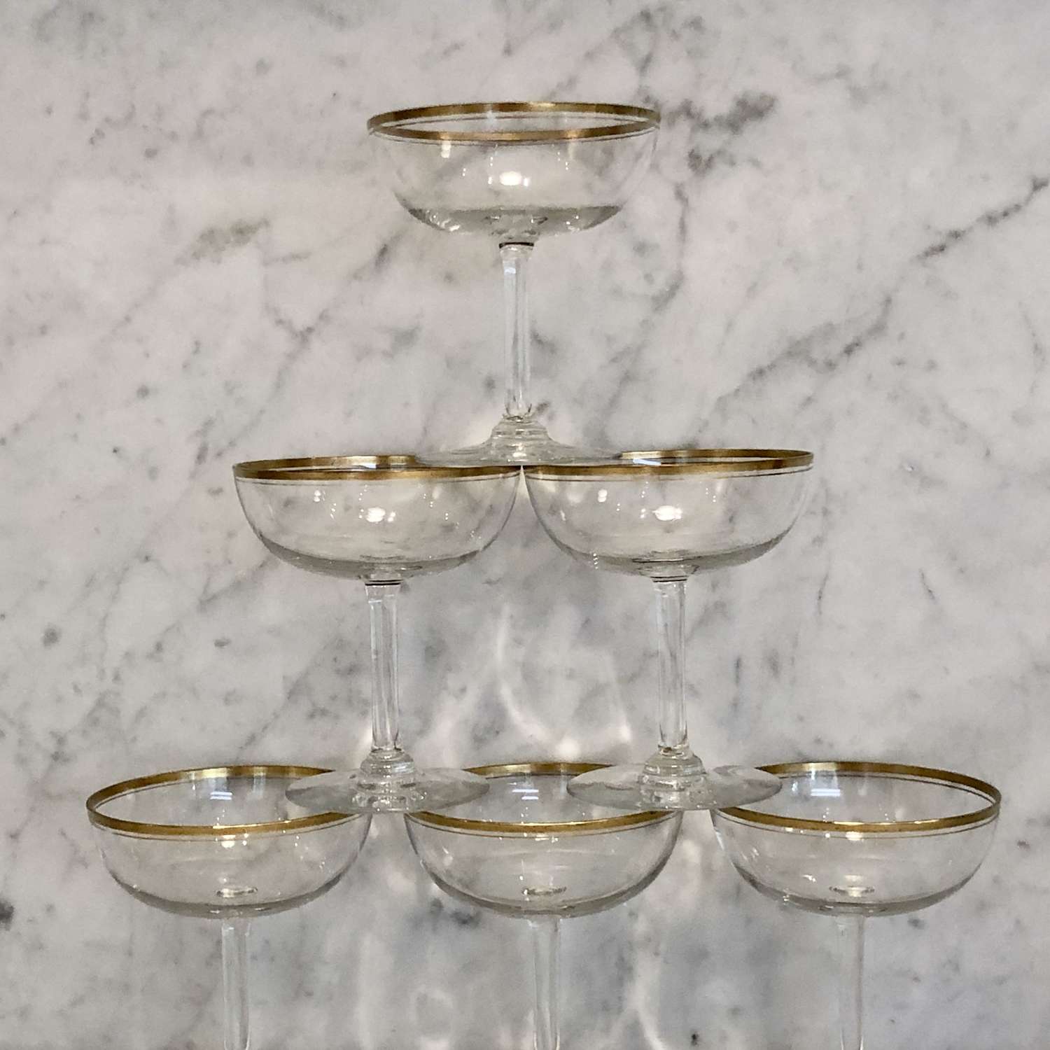 Six French gold rimmed champagne coupes or saucers