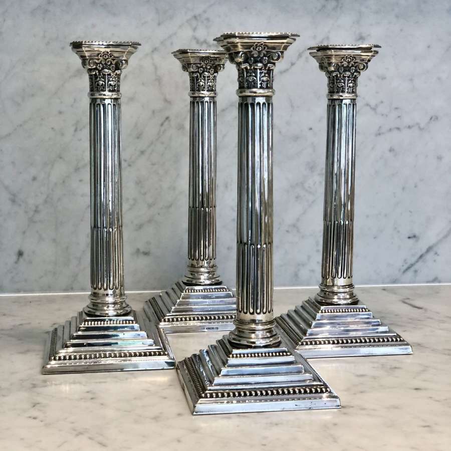 Excellent set of four tall silver plated Corinthian candlesticks