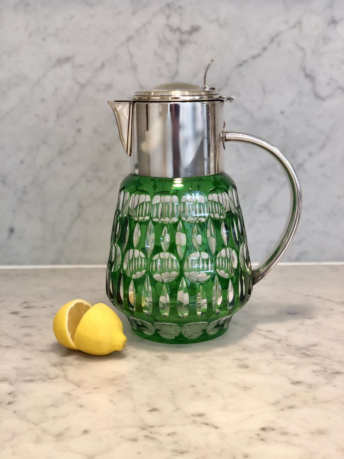 Green cut glass and silver plated lemonade cooling jug