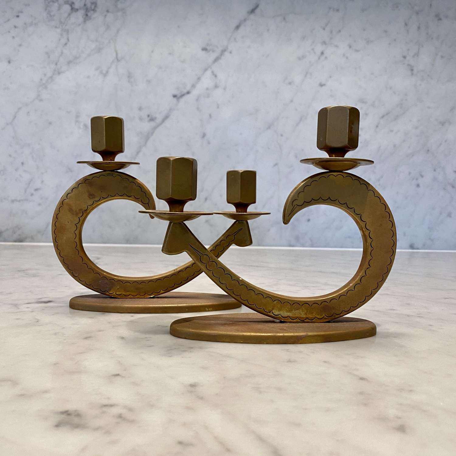 Pair of Art Deco copper twin light candlesticks