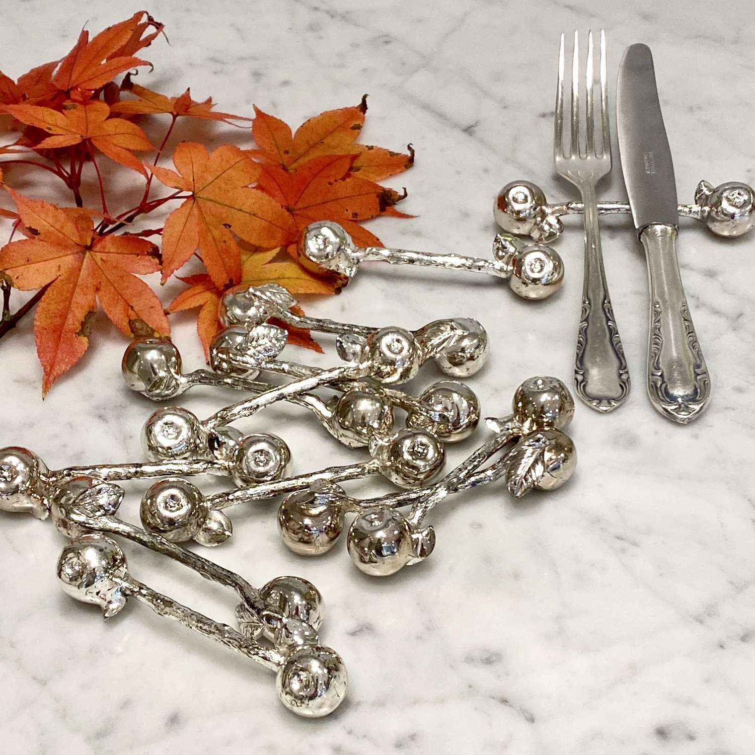 Set of 12 vintage silver plated Apple cutlery rests