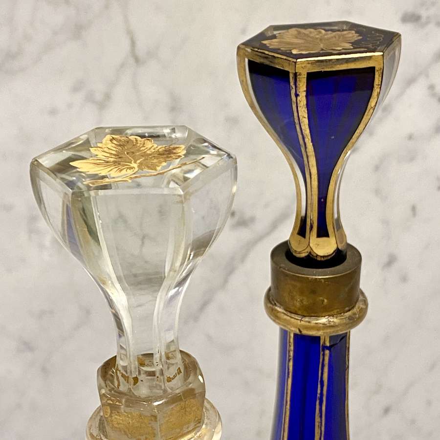 Early Victorian pair of gilded overlay and cut to clear decanters