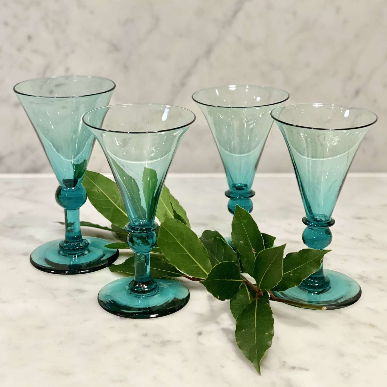Four early Victorian green trumpet glasses