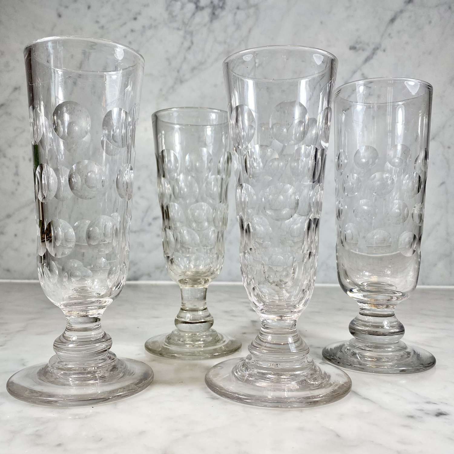 Four 19th Century tall hand blown and lens cut Ale glasses
