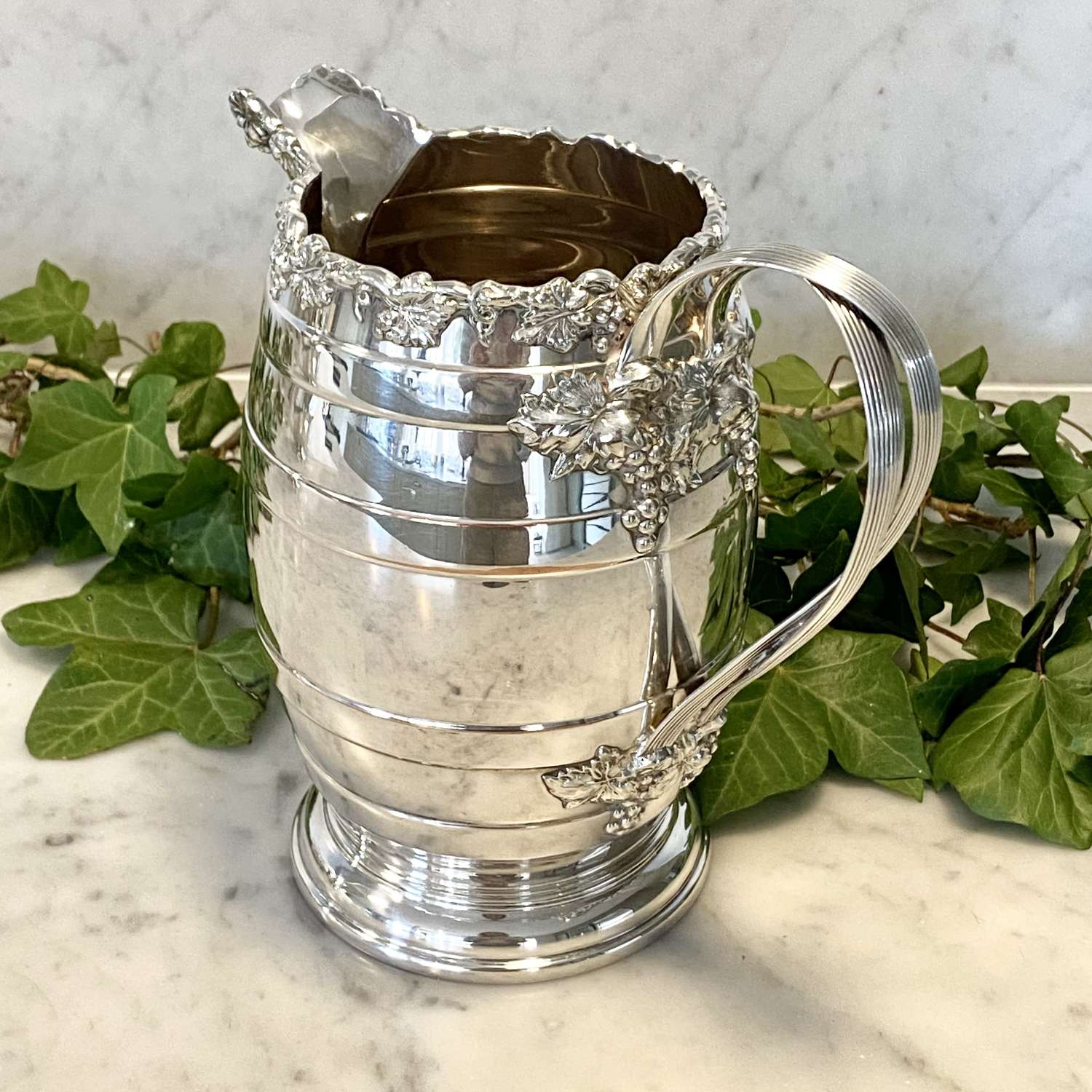 Smart Victorian silver plated vine and ribbon wine jug