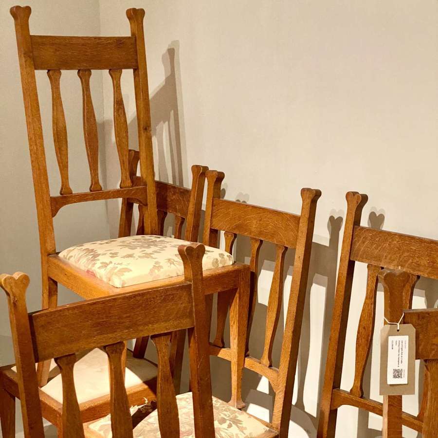 Set of 8 Art & Crafts golden oak dining chairs
