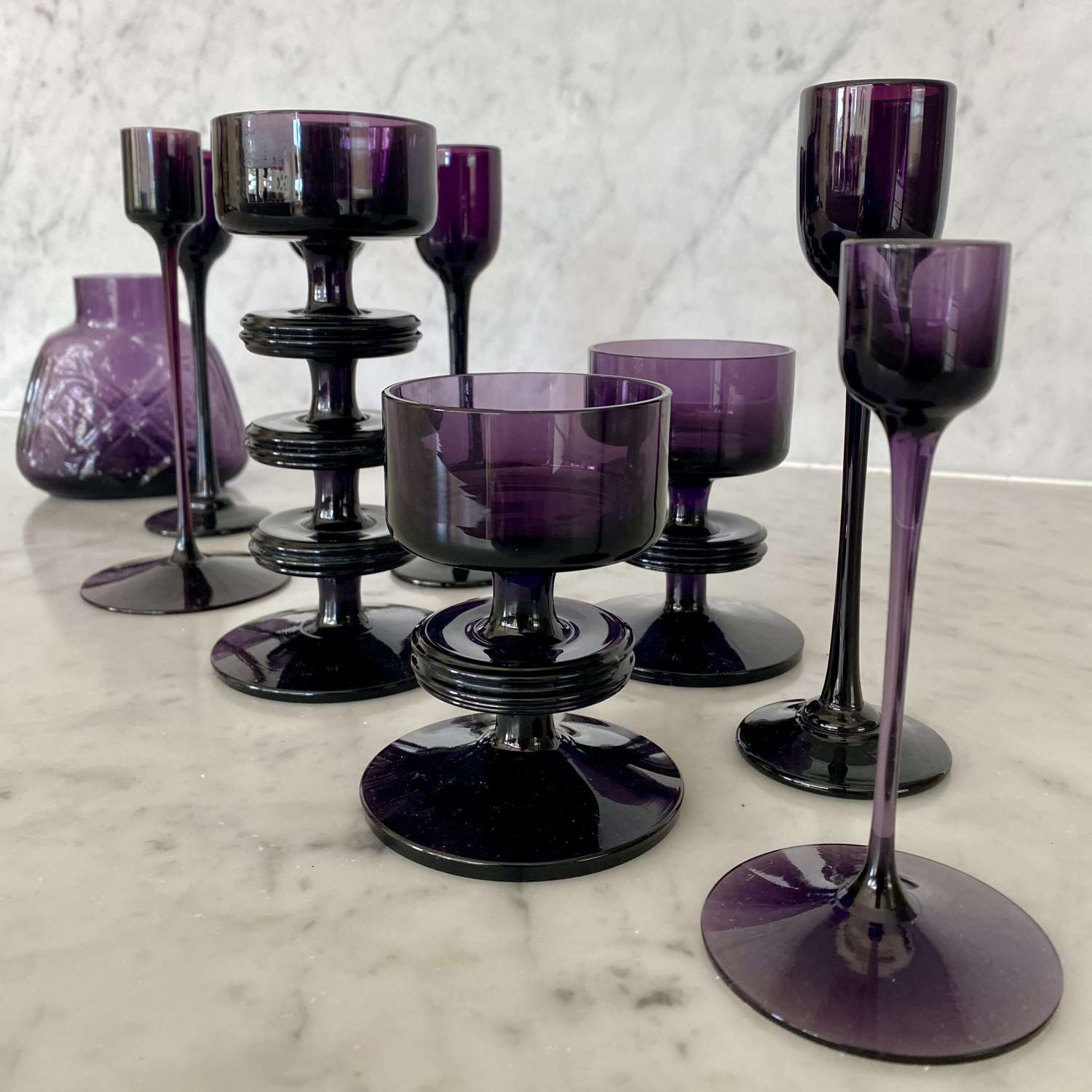 Matched set of 1970s purple glass candlesticks and vase