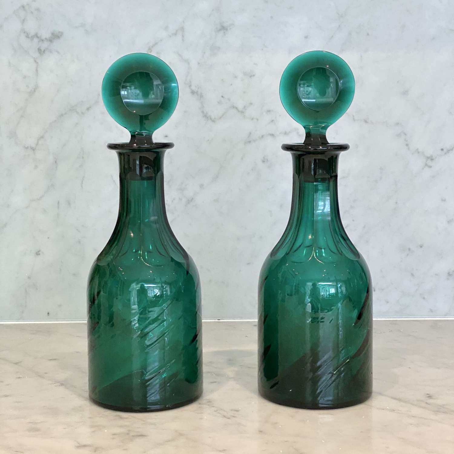Pair of Georgian wrythen glass Bullseye stopper decanters