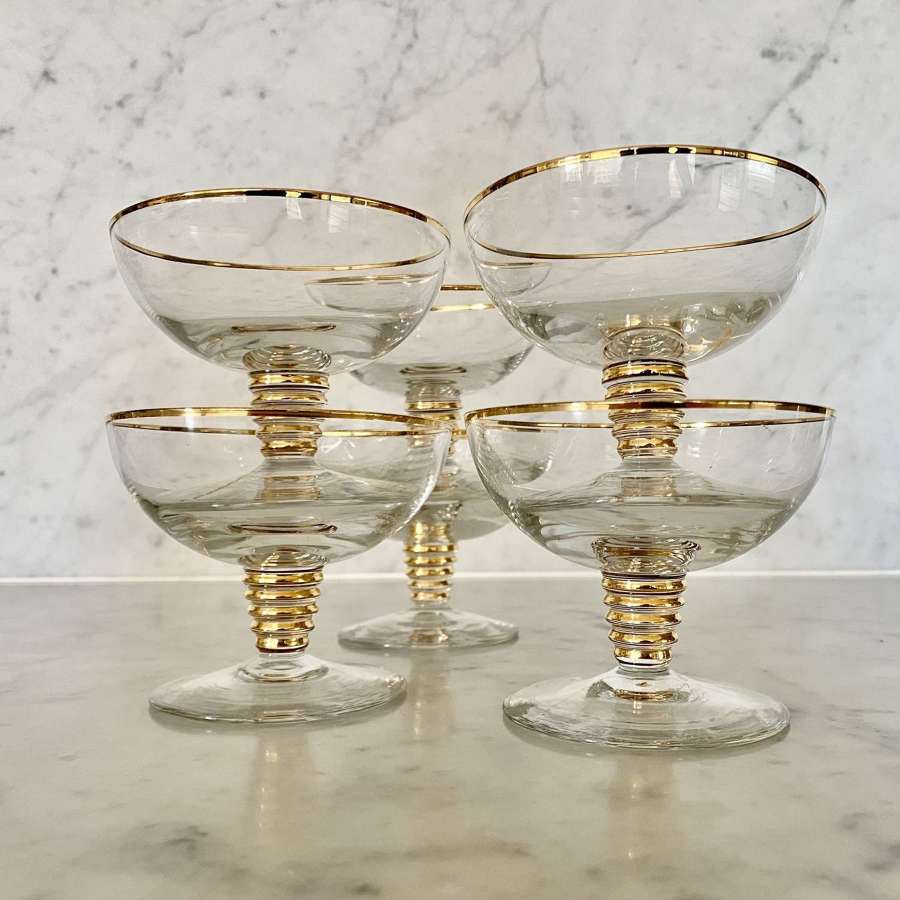 Set of six Mid Century gold rim champagne saucers
