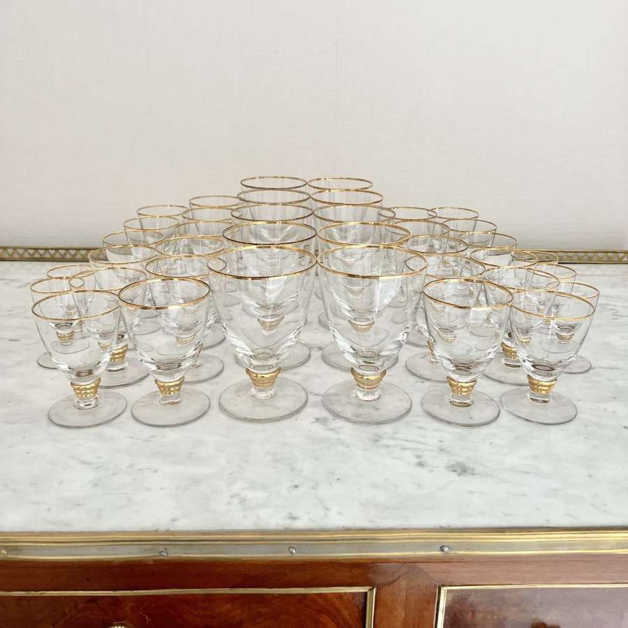 Large suite of 38 Mid Century gold rim drinking glasses