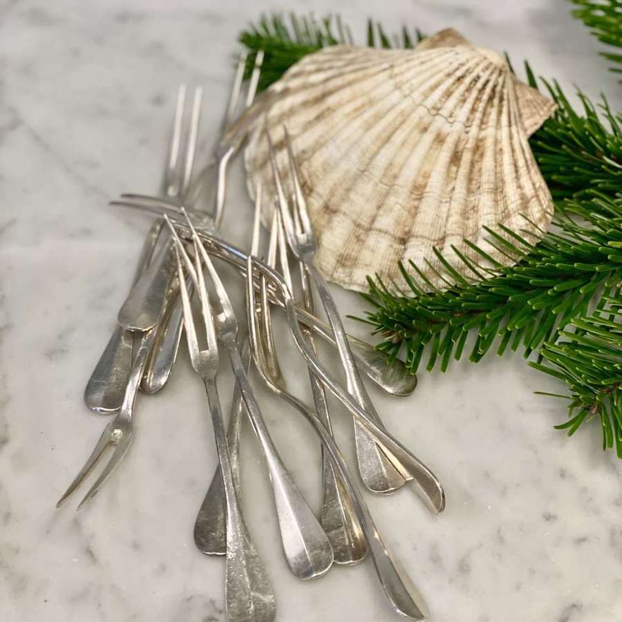 A dozen silver plated shellfish forks by Wiskemann