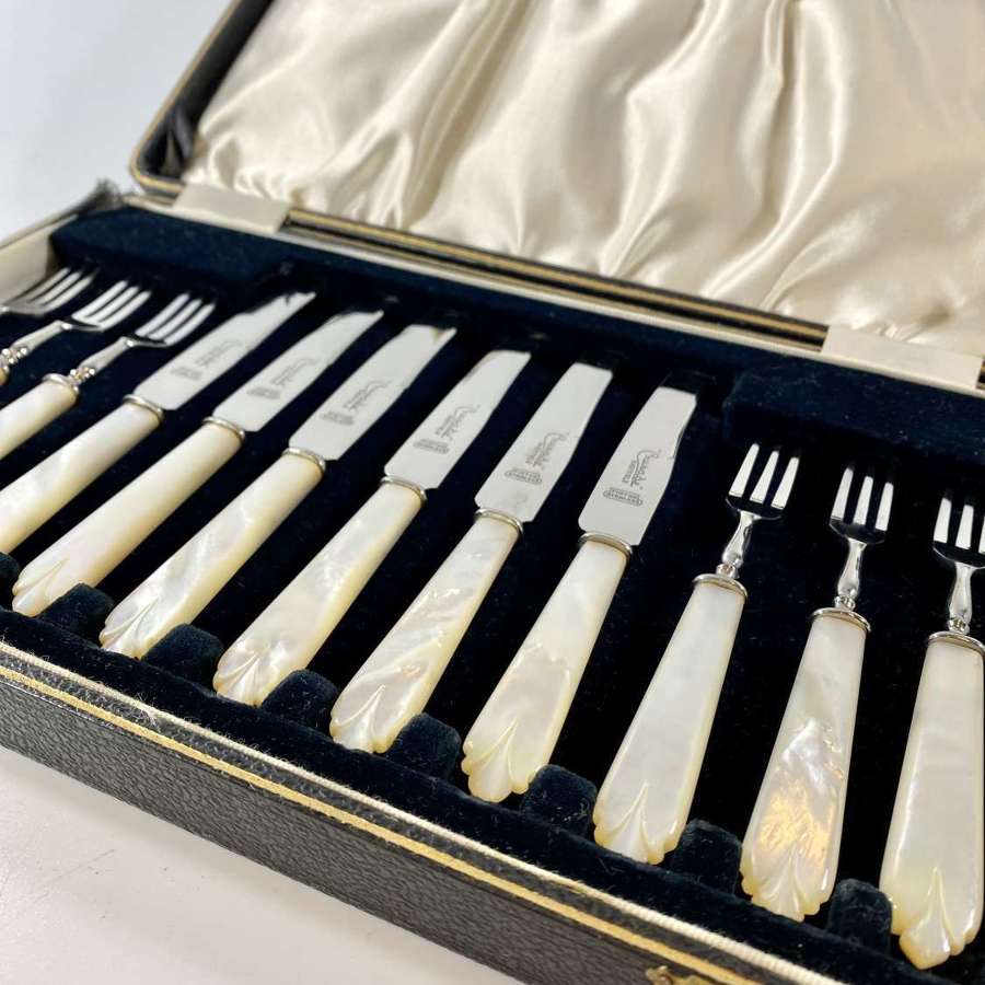 Boxed set of Art Deco carved mother of pearl handled cutlery set