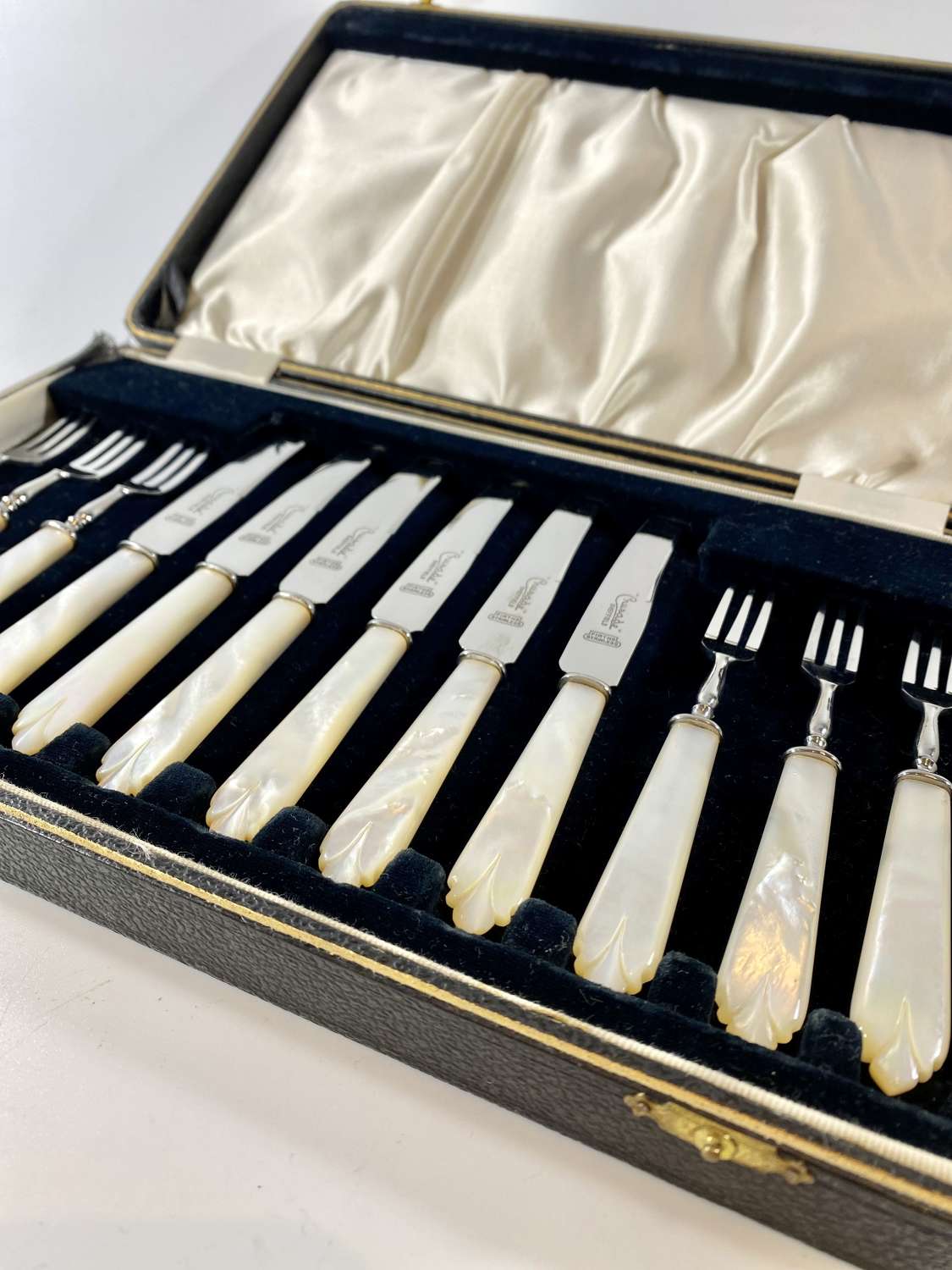 Boxed set of Art Deco carved mother of pearl handled cutlery set
