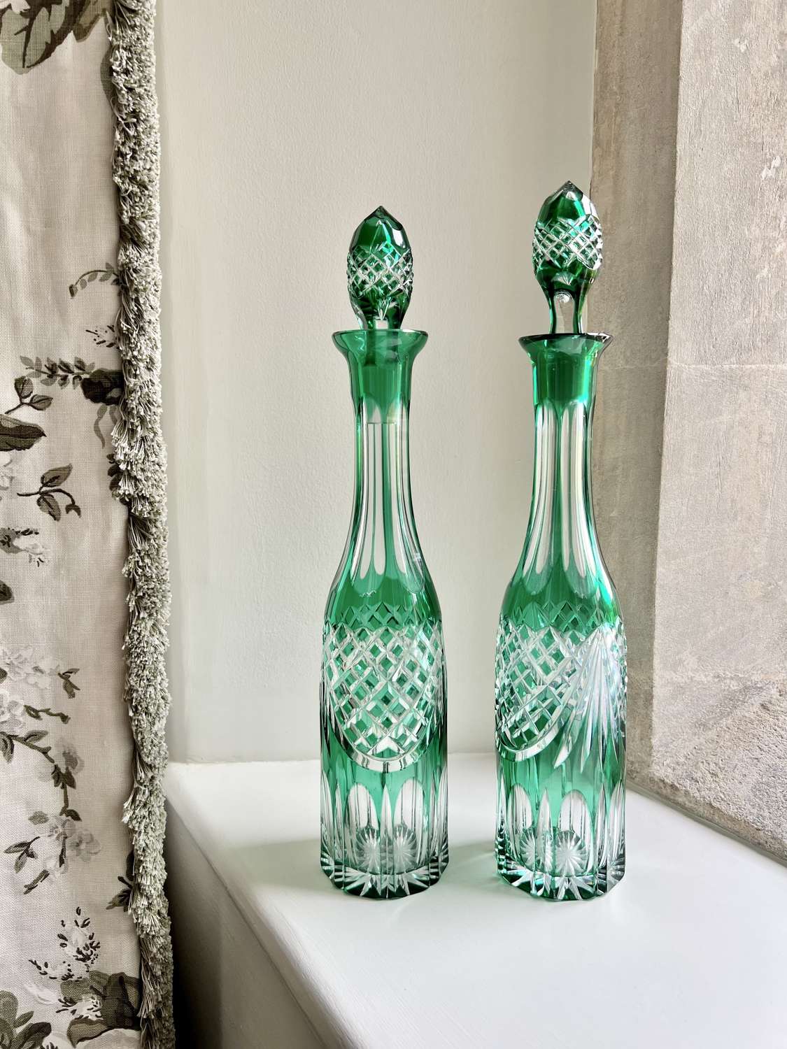 Pair of Victorian cut to clear emerald green glass decanters