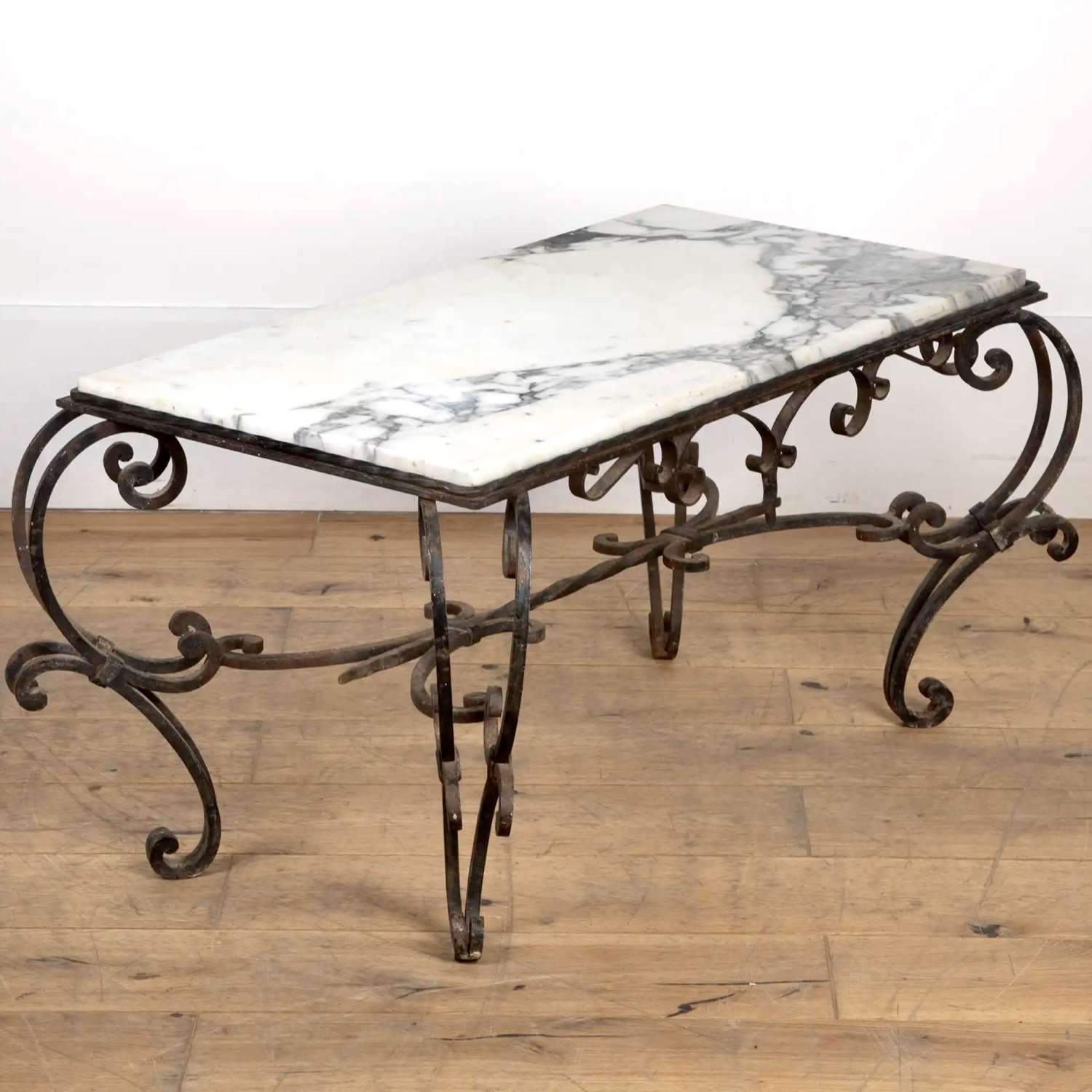 Ornate French wrought iron coffee table with marble top Circa 1950s