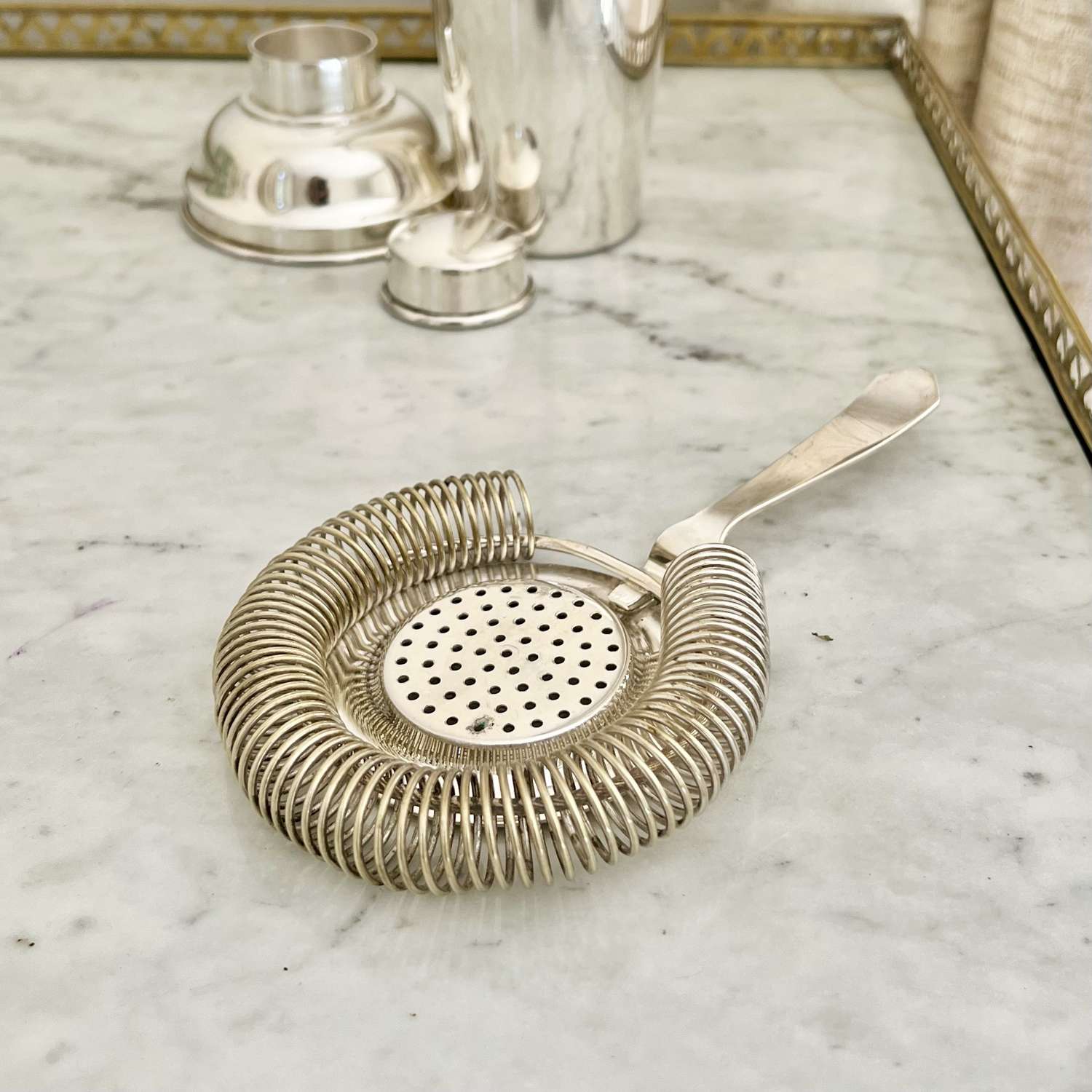 French silver plated handheld cocktail strainer