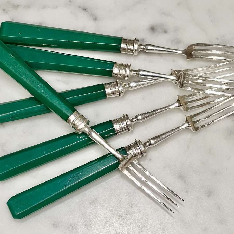 Art Deco silver dessert forks with emerald green handles