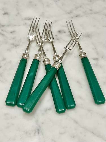 Art Deco silver dessert forks with emerald green handles