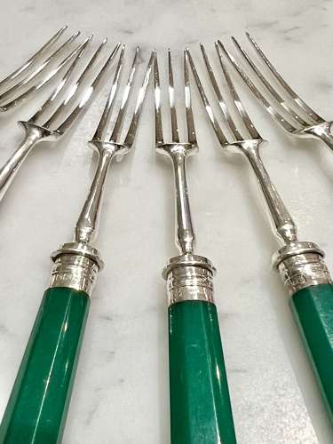 Art Deco silver dessert forks with emerald green handles