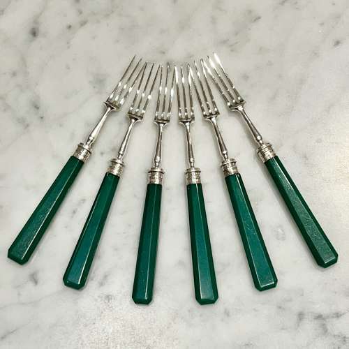 Art Deco silver dessert forks with emerald green handles