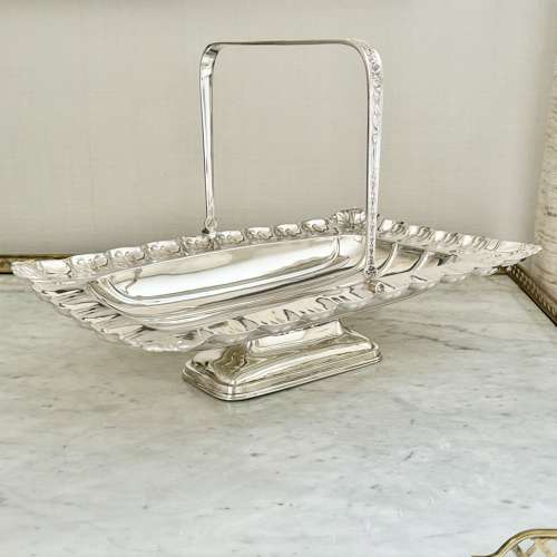 Exemplary Victorian large silver swing handle basket