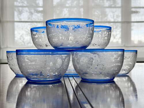 An outstanding set of a ten Art Deco wheel etched glass bowls hand applied blue e