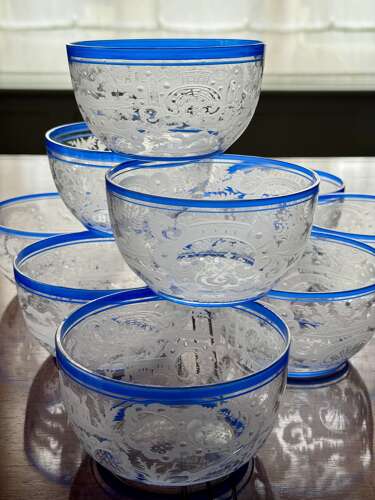 An outstanding set of a ten Art Deco wheel etched glass bowls hand applied blue e