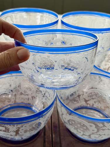 An outstanding set of a ten Art Deco wheel etched glass bowls hand applied blue e