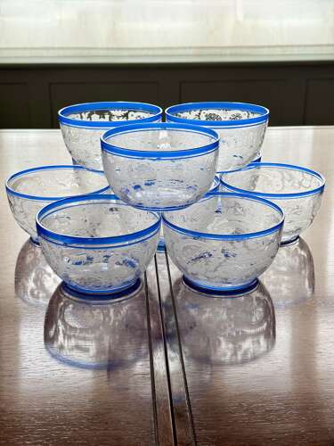 An outstanding set of a ten Art Deco wheel etched glass bowls hand applied blue e