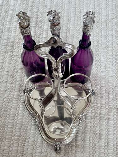 Early Victorian Triple amethyst decanters and silver plated stand dated 1839