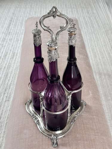 Early Victorian Triple amethyst decanters and silver plated stand dated 1839