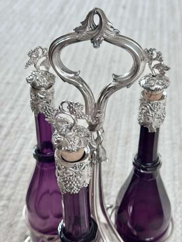 Early Victorian Triple amethyst decanters and silver plated stand dated 1839
