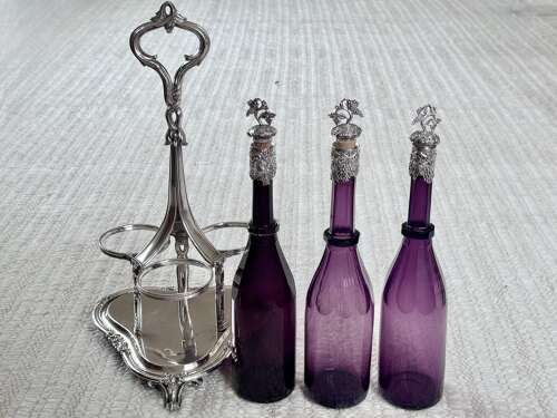 Early Victorian Triple amethyst decanters and silver plated stand dated 1839